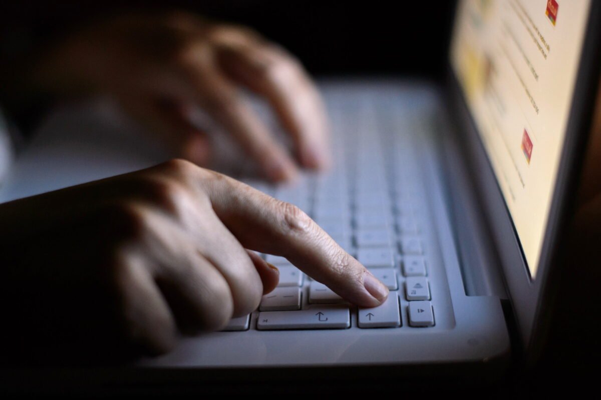 A person using a computer in an undated file photo. (Dominic Lipinski/PA Media)