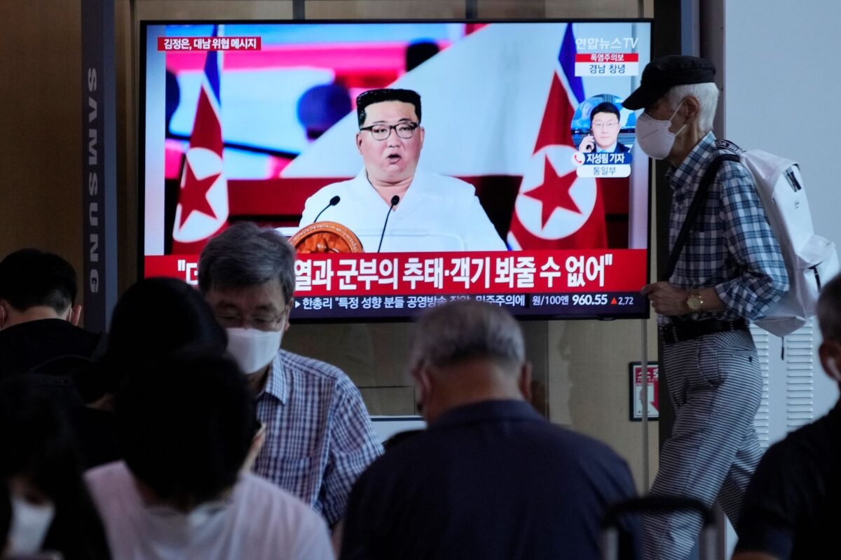 People watch a TV showing an image of North Korea leader Kim Jong Un, during a news program at the Seoul Railway Station in Seoul, South Korea, on July 28, 2022. (Ahn Young-joon/AP Photo)