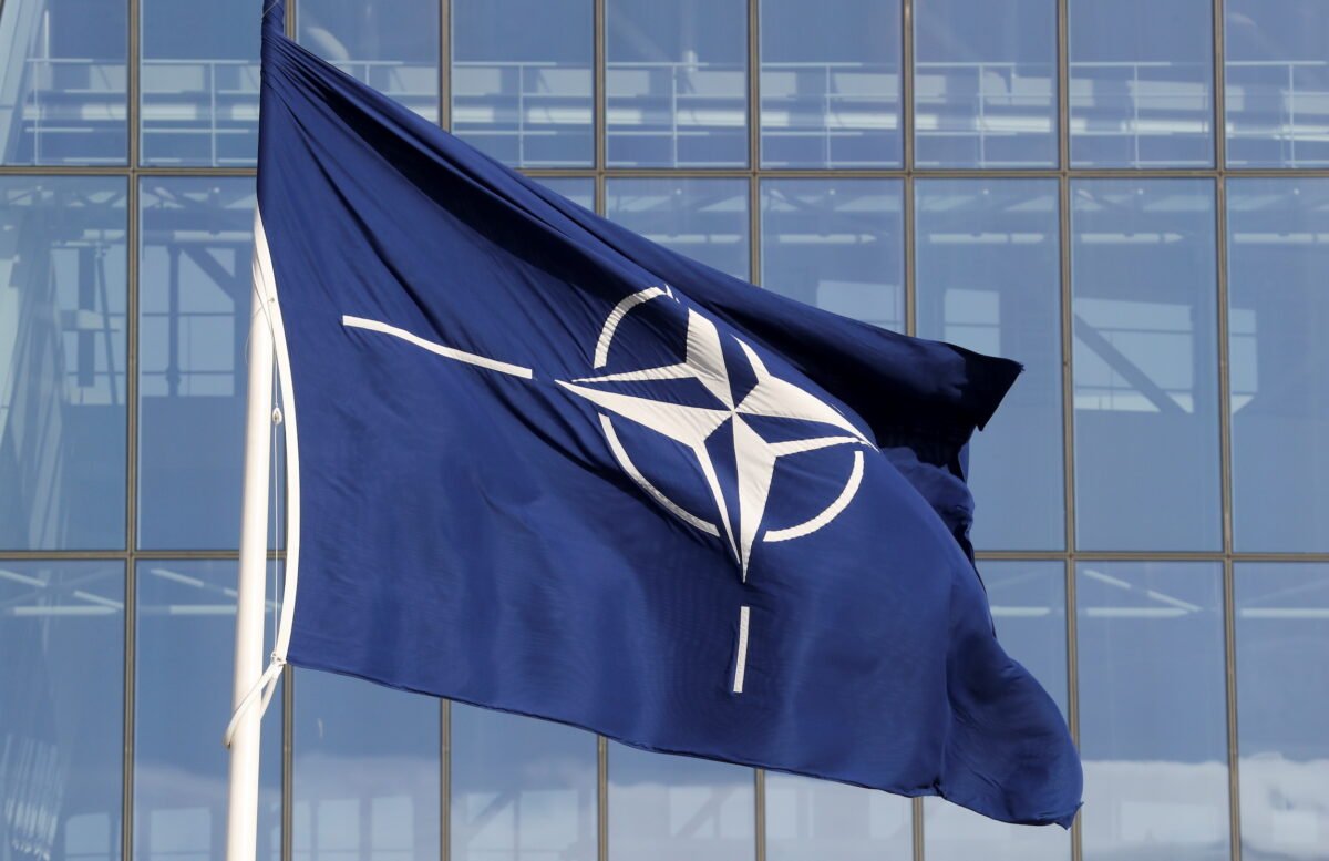 A NATO flag is seen at the Alliance headquarters ahead of a NATO Defense Ministers meeting, in Brussels, on Oct. 21, 2021. (Pascal Rossignol/Reuters)
