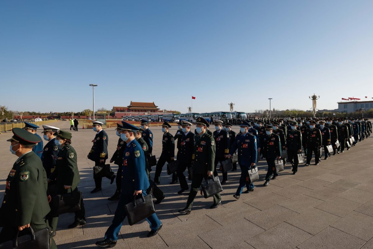 Delegates arrive to the fifth plenary session of the National People's Congress in Beijing, China on March 12, 2023. (Lintao Zhang/Getty Images)