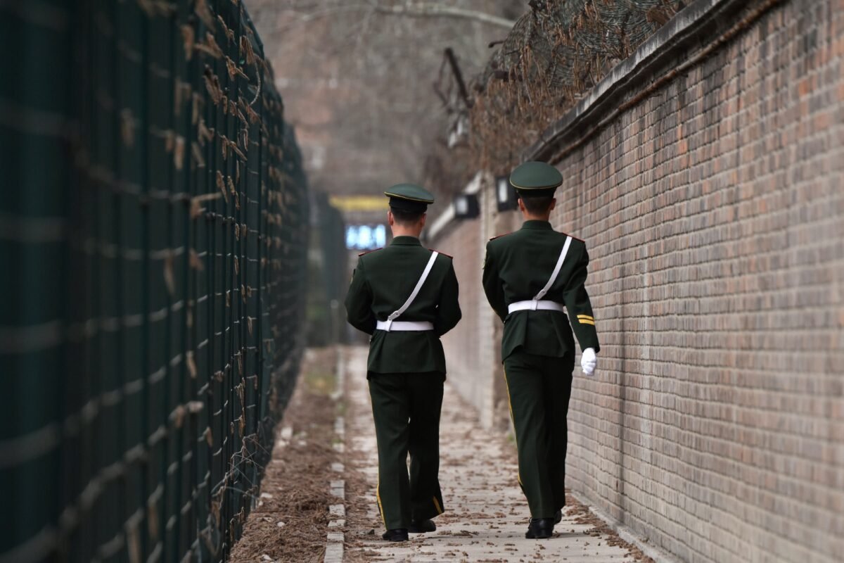 Chinese paramilitary police officers patrol in Beijing on March 28, 2018. (Greg Baker/AFP via Getty Images)