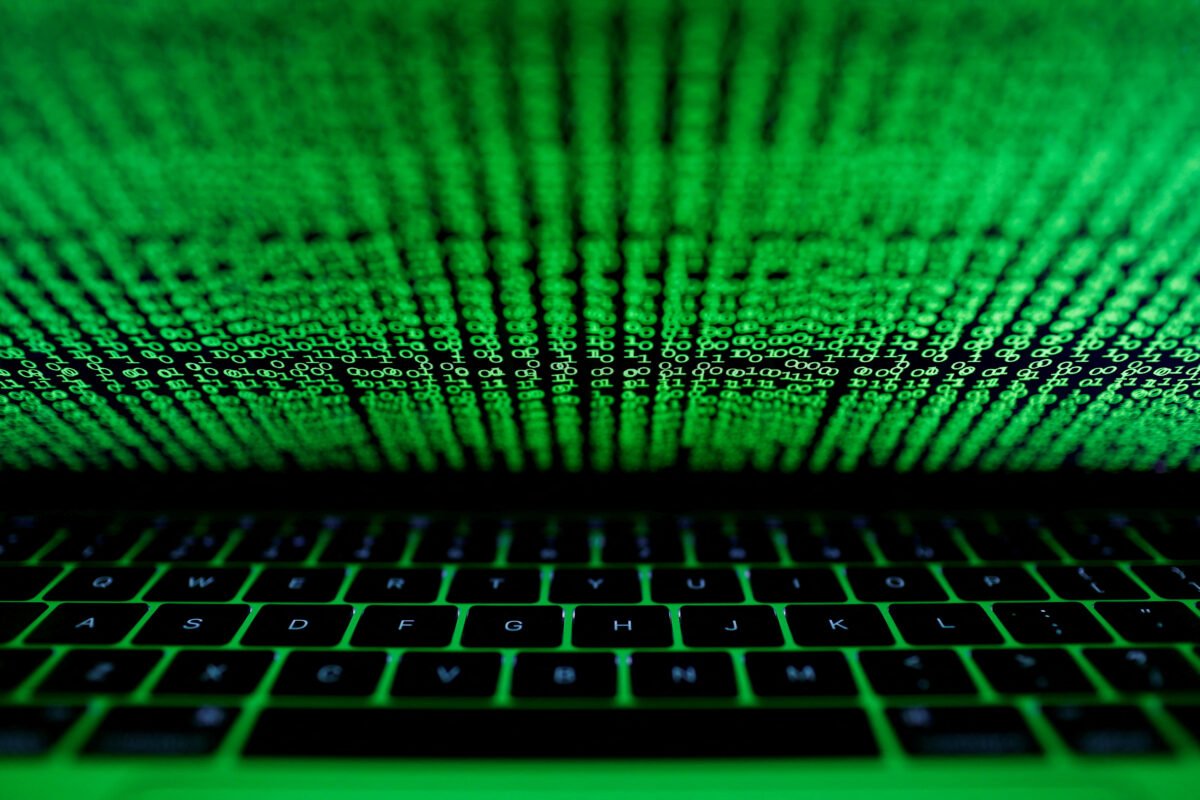 A computer keyboard is lit by a displayed cyber code in this picture taken on March 1,  2017. (Kacper Pempel/Illustration/Reuters)