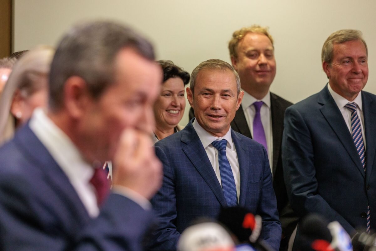 WA Premier Roger Cook looks on as former Western Australian Premier Mark McGowan speaks to media during a press conference at Dumas House in Perth, Australia, on May 29, 2023. (AAP Image/Richard Wainwright)