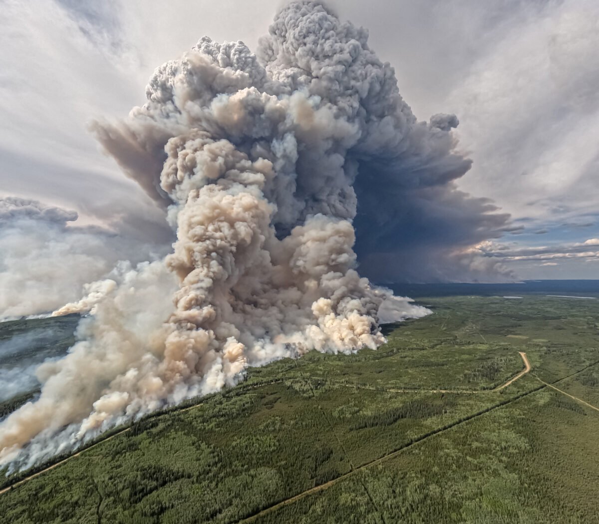 Smoke billows upwards from a planned ignition by firefighters tackling the Donnie Creek Complex wildfire south of Fort Nelson, British Columbia, Canada June 3, 2023.  B.C. Wildfire Service/Handout via REUTERS.