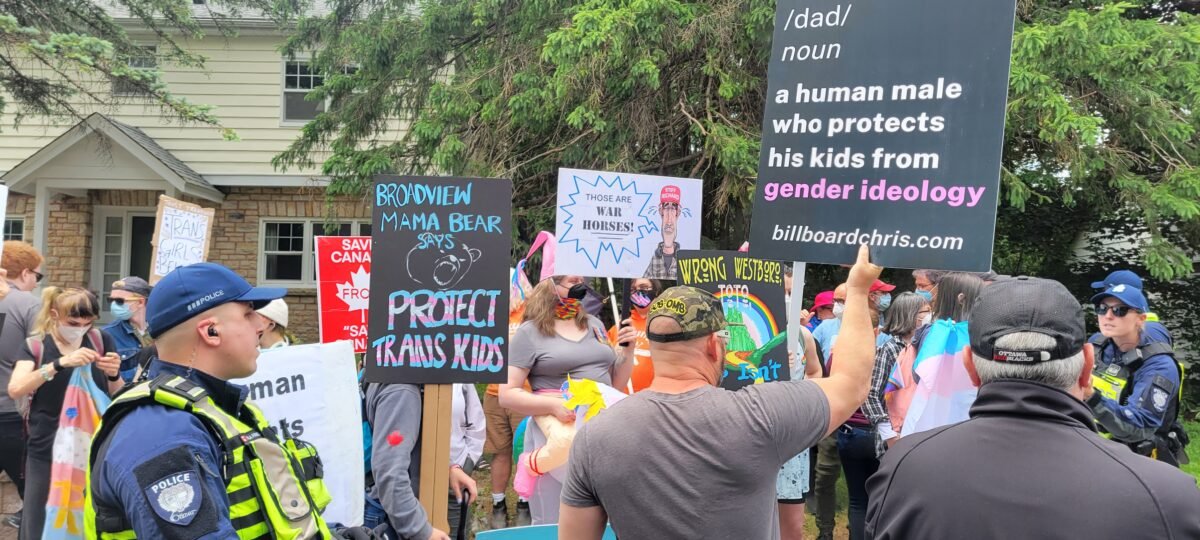 Hundreds of protestors and counter-protestors gather in Ottawa's west end to clash over gender ideology being taught in schools. (Matthew Horwood/The Epoch Times)