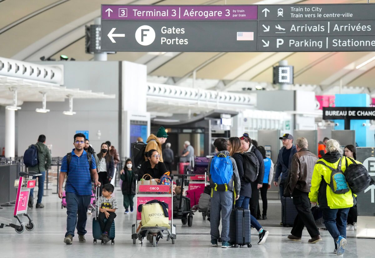 People are shown at Pearson International Airport in Toronto on March 10, 2023. (The Canadian Press/Nathan Denette)