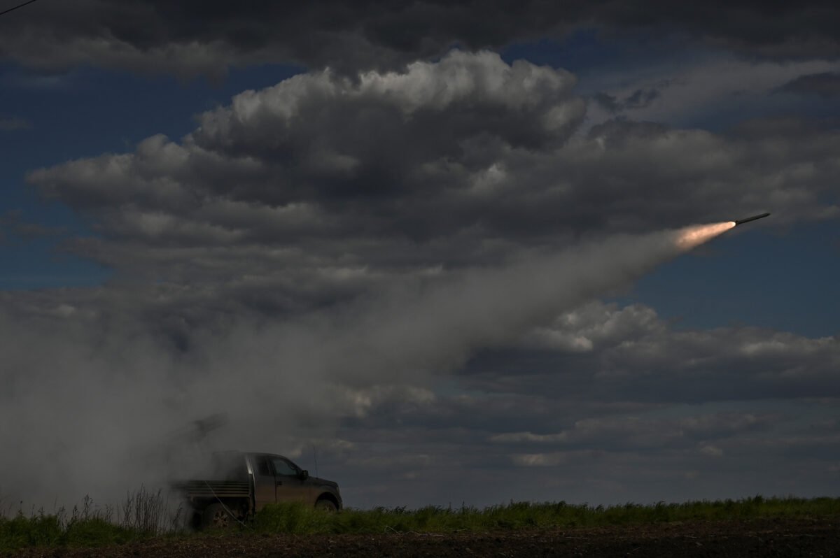 Ukrainian servicemen fire a Partyzan multiple launch rocket system towards Russian troops near a frontline in the Zaporizhzhia region, Ukraine on May 12, 2023. (Stringer/Reuters)