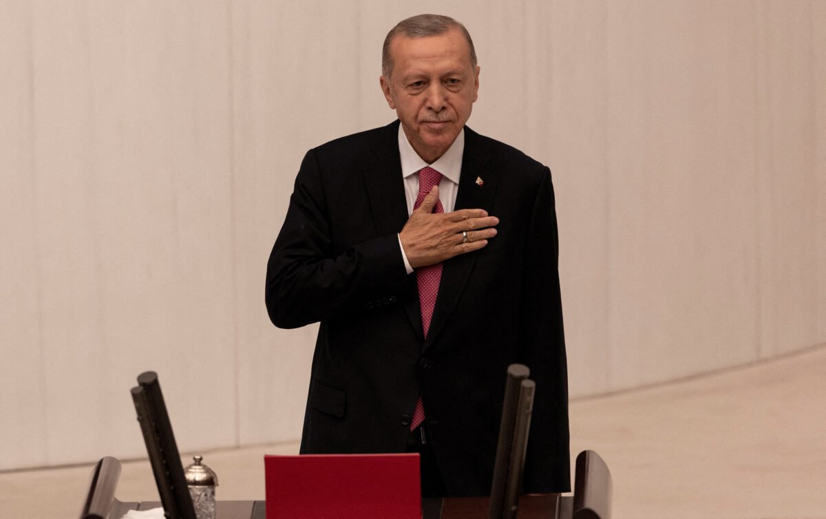 Turkish President Tayyip Erdogan greets members of the parliament and guests as he arrives to take his oath after his election win in Ankara, Turkey, on June 3, 2023. (Umit Bektas/Reuters)