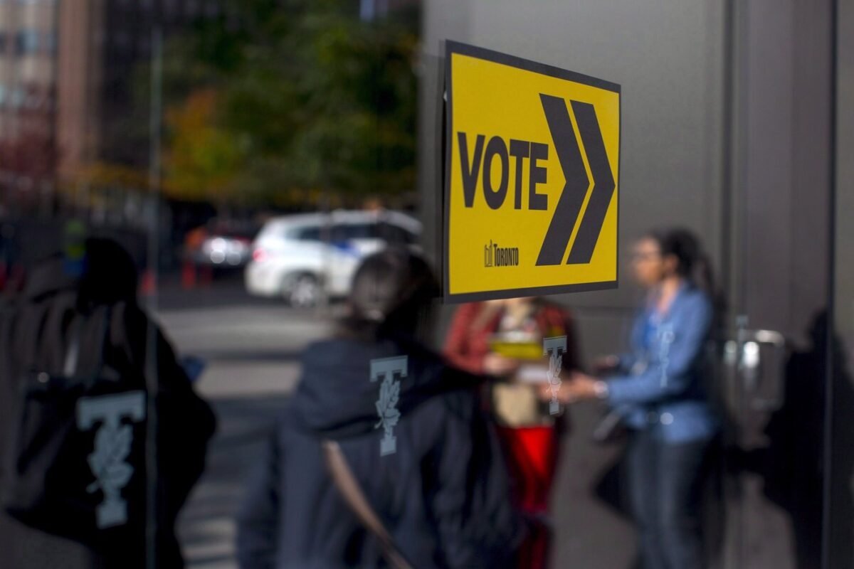 Voters line up outside a voting station to cast their ballot in the Toronto's municipal election in Toronto on Oct. 22, 2018. (The Canadian Press/Chris Young)