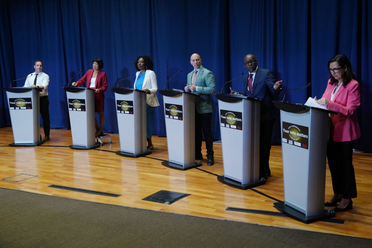 (L-R) Toronto mayoral candidates Josh Matlow Olivia Chow, Mitzie Hunter, Brad Bradford, Mark Saunders, and Ana Bailao take the stage at a mayoral debate in Scarborough, Ont. on  May 24, 2023. (THE CANADIAN PRESS/Chris Young)