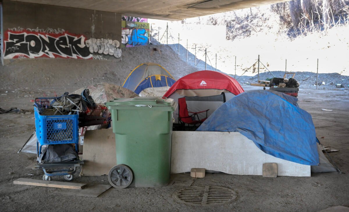 A homeless camp is shown beneath an overpass in Montreal on April 14, 2023.  (The Canadian Press/Graham Hughes)