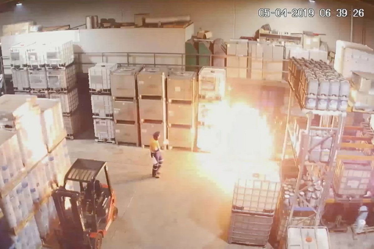 A supplied CCTV screen grab shows the moment a fire erupts after a worker attempted to decant a dangerous chemical at Bradbury Industrial Services' warehouse on Thornycroft Street at Campbellfield on April 5, 2019. (AAP Image/Supplied by County Court of Victoria)