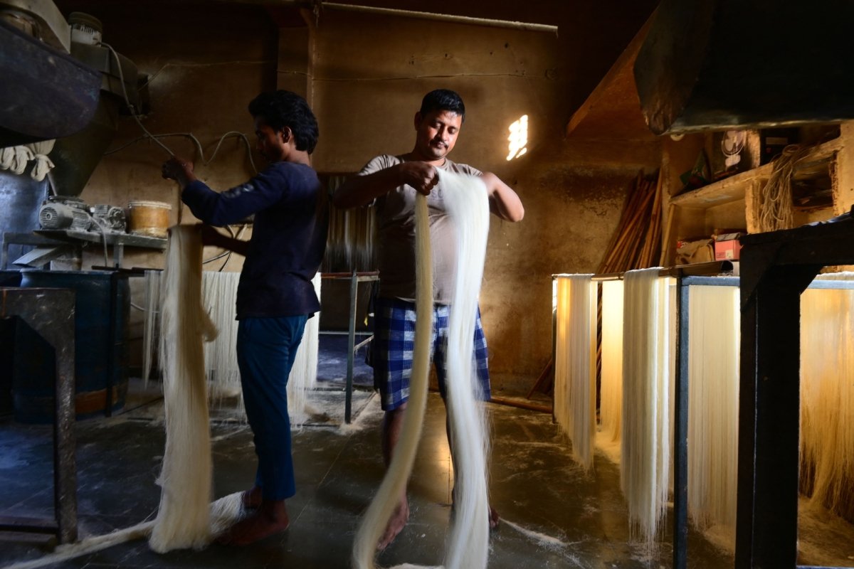 Workers prepare vermicelli, which is used to make traditional sweet dishes popularly consumed during the holy month of Ramadan, at a factory in Prayagraj, India, on March 22, 2023. (Sanjay Kanojia/AFP via Getty Images)