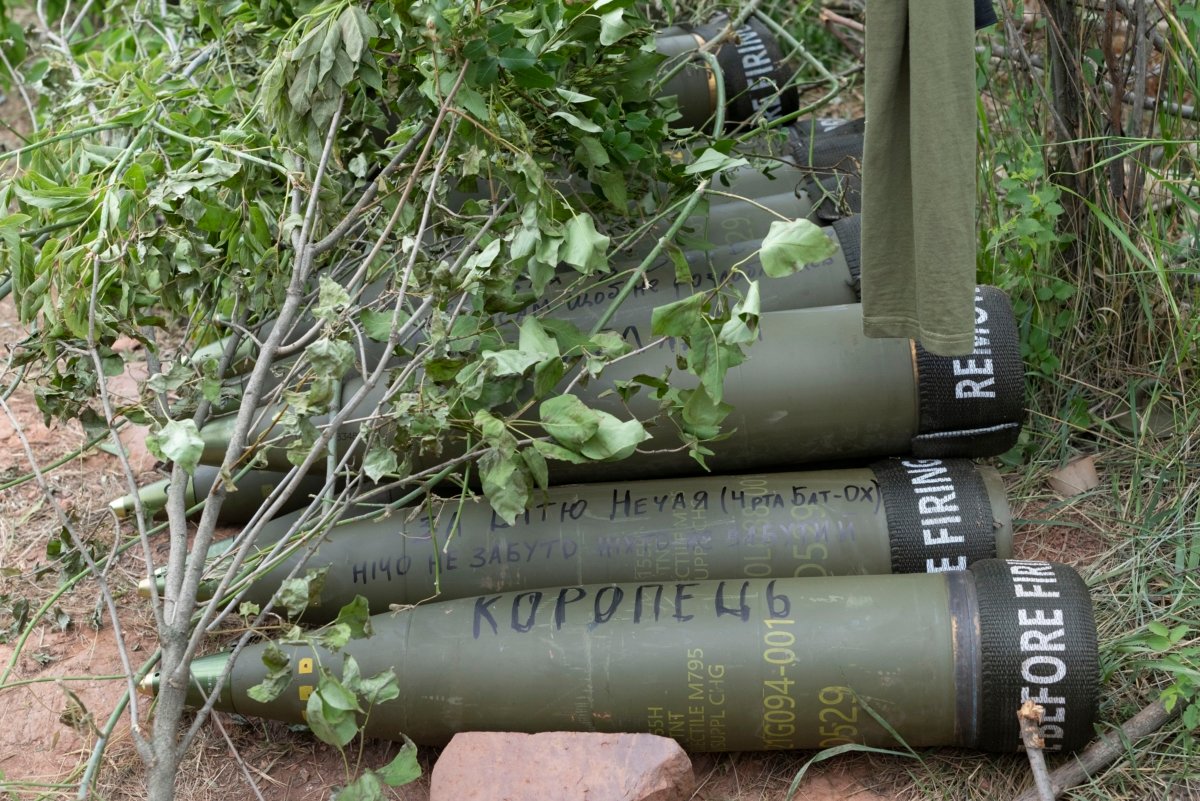 U.S.-supplied M777 howitzer shells lie on the ground to fire at Russian positions in Ukraine's eastern Donbas region on June 18, 2022. (Efrem Lukatsky/AP Photo)