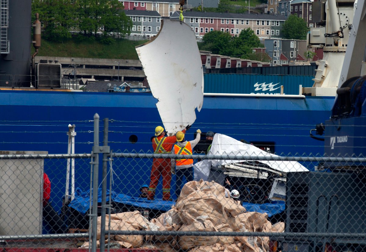 Debris from the Titan submersible, recovered from the ocean floor near the wreck of the Titanic, is unloaded from the ship Horizon Arctic at the Canadian Coast Guard pier in St. John's, Newfoundland, on June 28, 2023. (Paul Daly/The Canadian Press via AP)