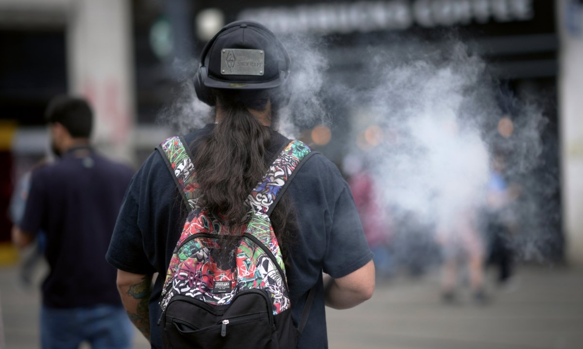 A man smokes a vape device  in Manchester, England, on May 30, 2023. (Christopher Furlong/Getty Images)