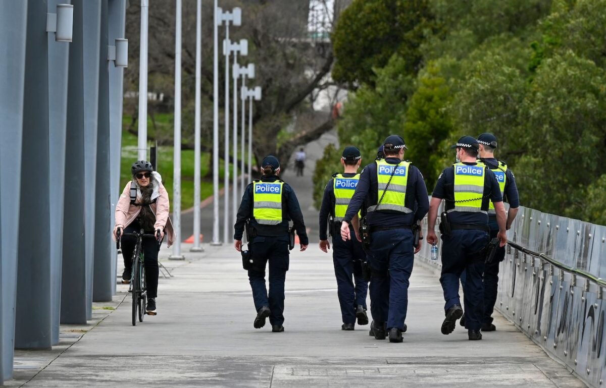 Police patrol the quiet streets of Melbourne, Australia, on Oct. 4, 2021. (William West/AFP via Getty Images)