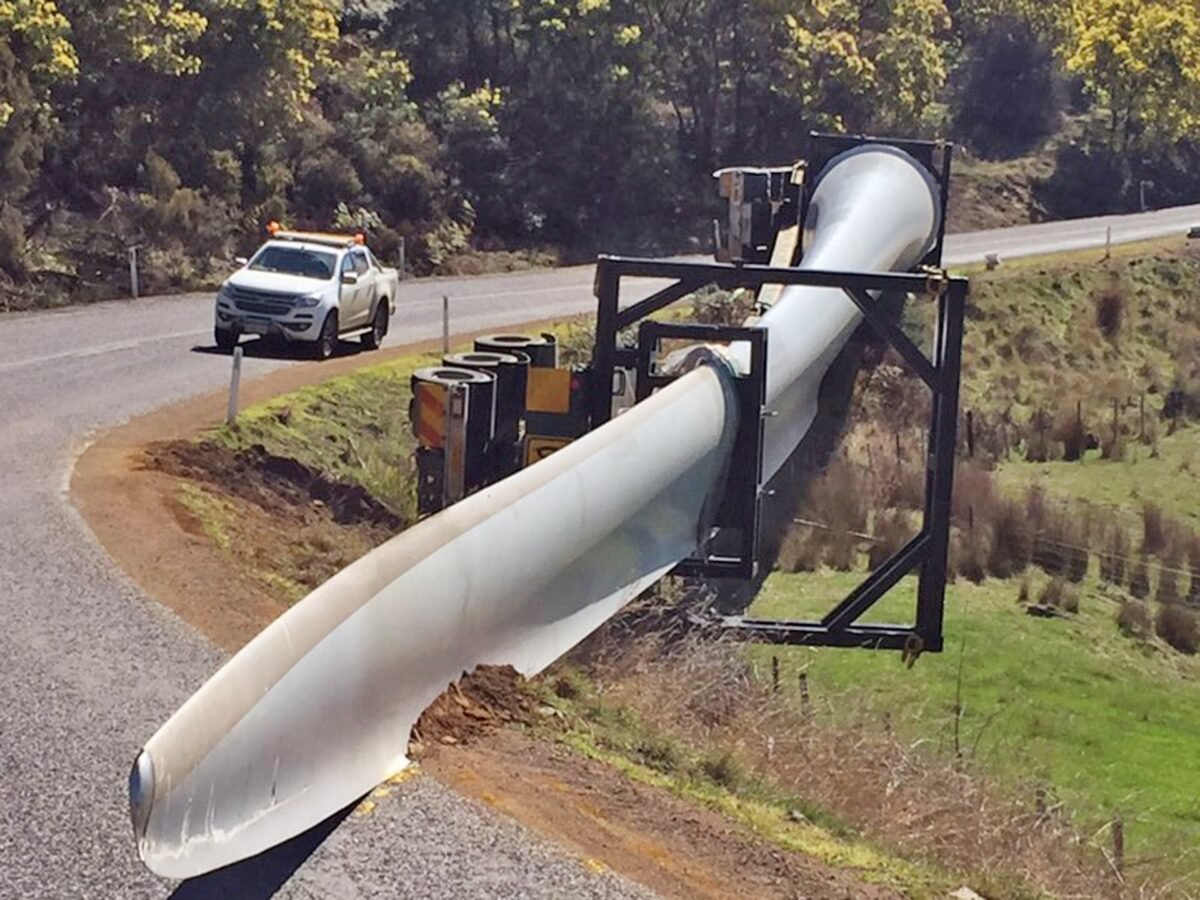 A supplied image shows a truck that rolled while carrying an 68-metre-long wind turbine blade at Apsley in the state's Central Highlands, Tasmania, Australia obtained on Sept. 19, 2019. (AAP Image/Supplied by Tasmania Police