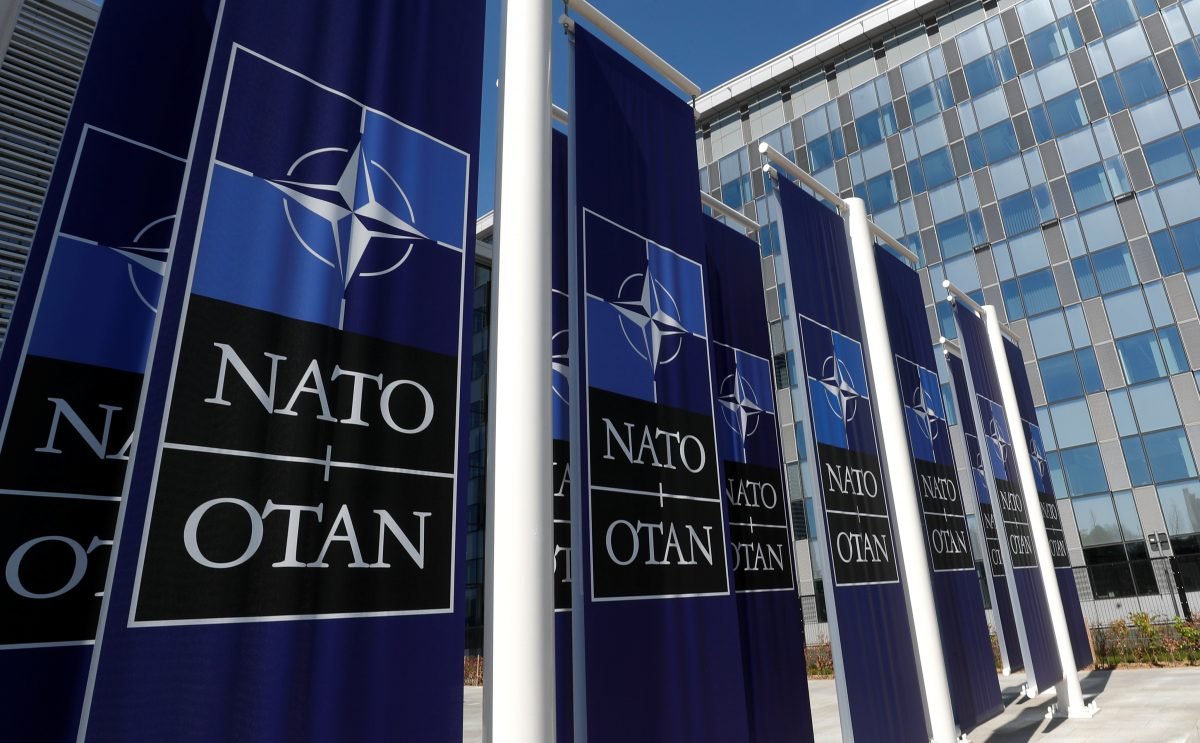 Banners displaying the NATO logo are placed at the entrance of new NATO headquarters during the move to the new building, in Brussels, Belgium, on April 19, 2018. (Yves Herman/Reuters)