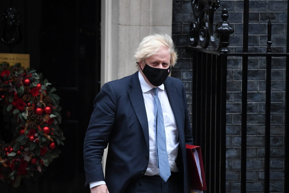 Then Prime Minister Boris Johnson leaves Downing Street to attend Prime Minister's Questions in the House of Commons, on Dec. 8, 2021. (Chris J Ratcliffe/Getty Images)