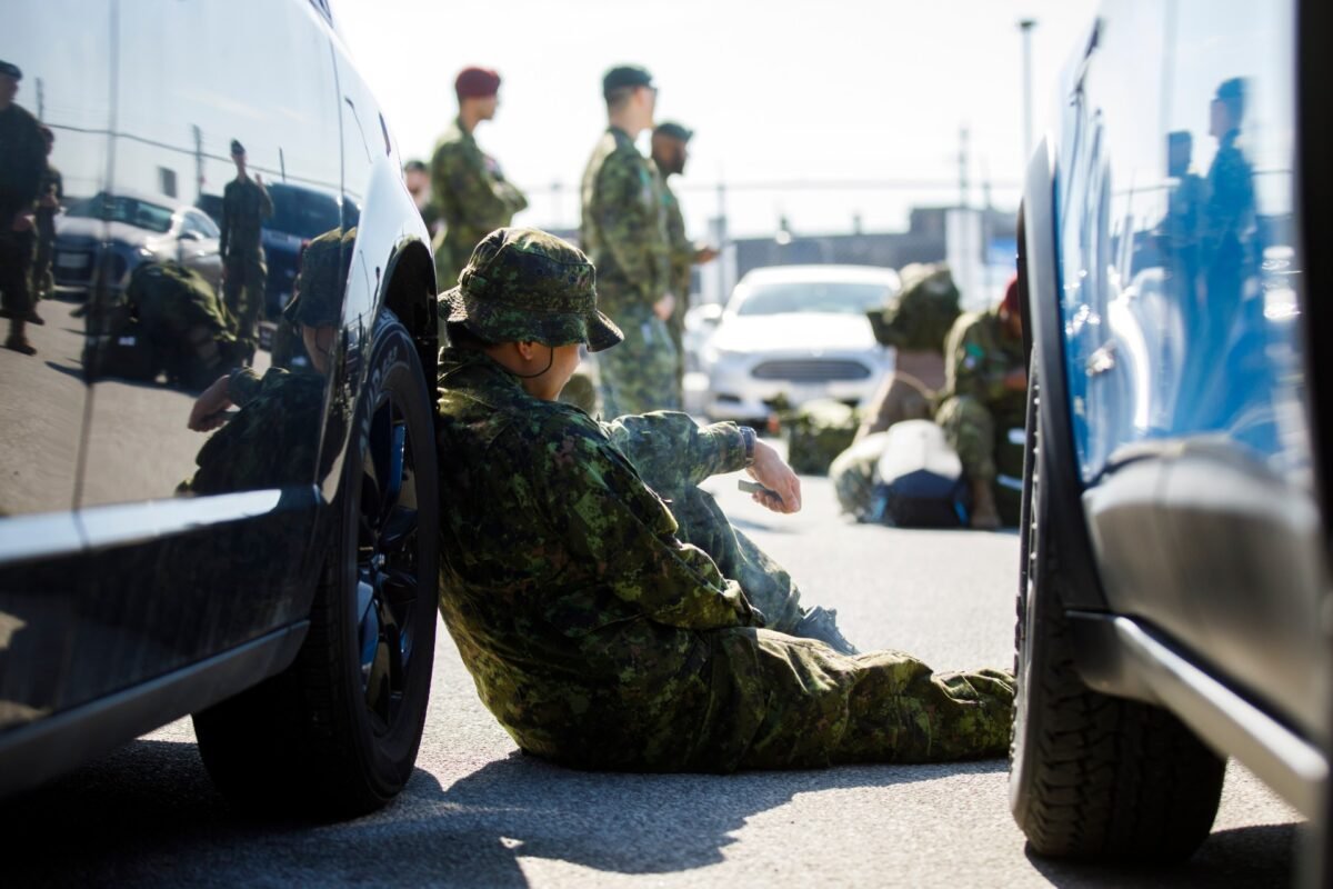 Members of the Canadian Forces wait to convoy to CFB Borden in Toronto, on April 6, 2020. (Cole Burston/Getty Images)