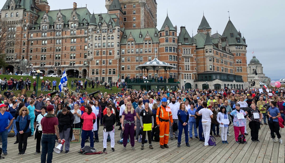 Frontline workers and first responders stand in silence to protest the province's vaccine mandates in Quebec City on Oct. 15, 2021. (The Epoch Times/Sonia Rouleau)