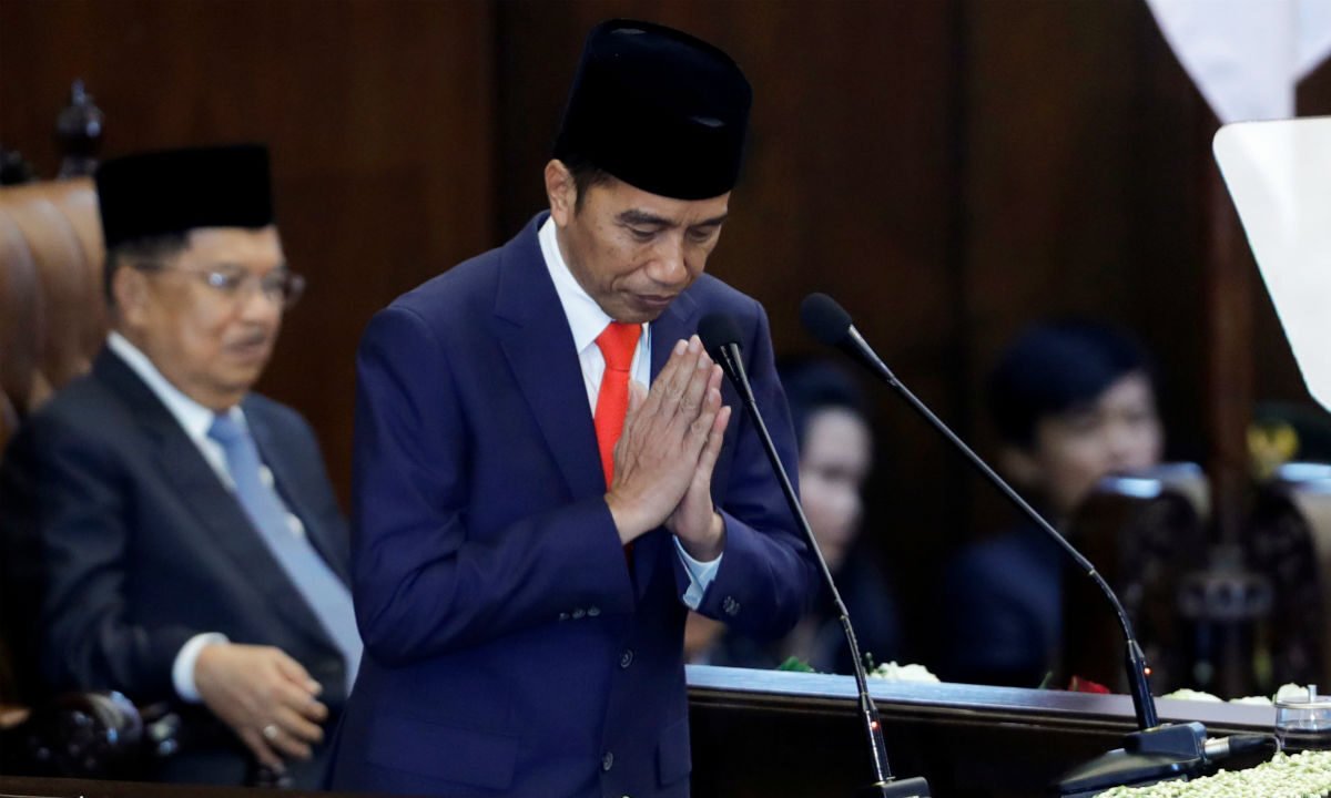 Indonesian President Joko Widodo bows after taking his oath during his presidential inauguration for the second term, at the House of Representatives building in Jakarta, Indonesia on Oct. 20, 2019. (Adi Weda/Pool via Reuters)