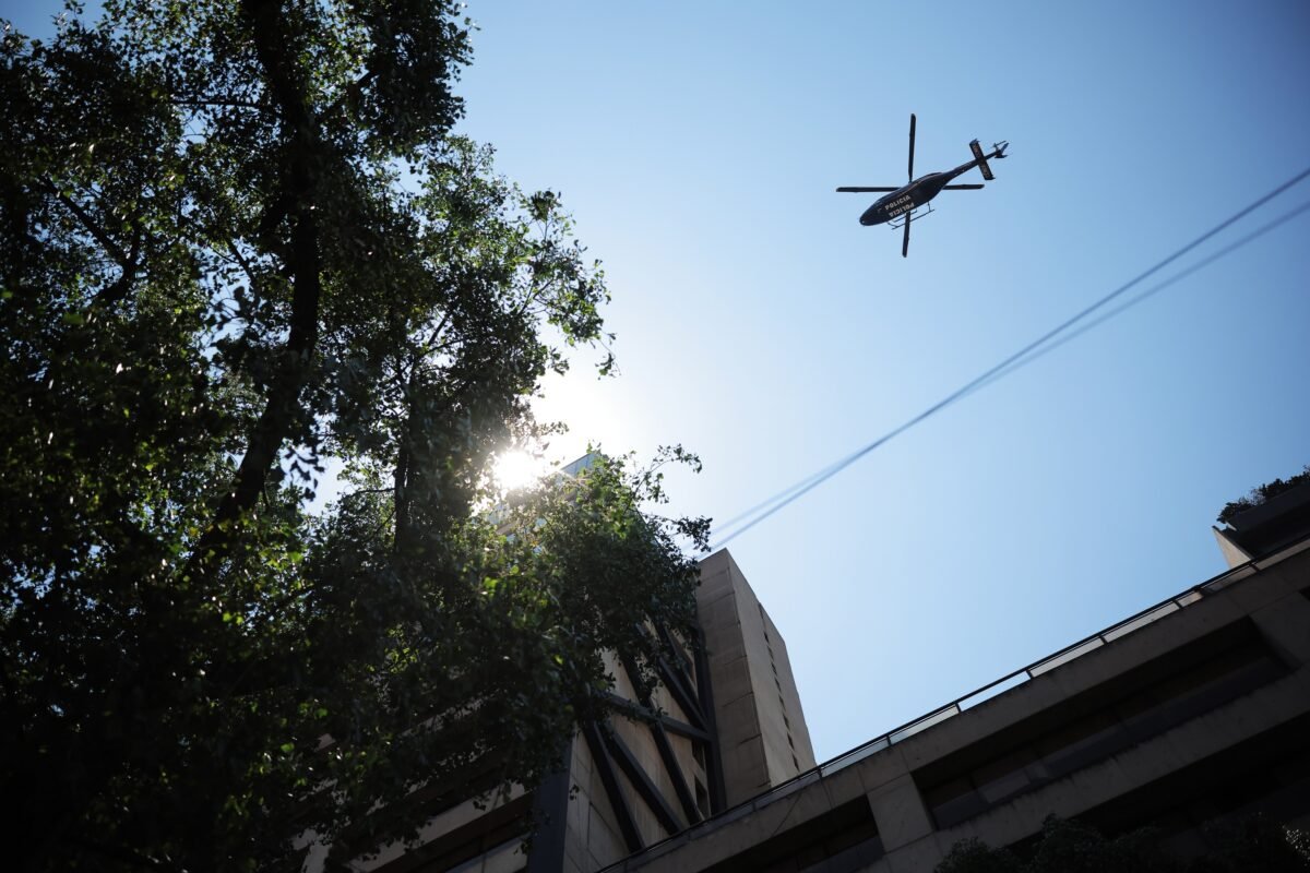 A police helicopter flies over Mexico City, on April 19, 2023. (Hector Vivas/Getty Images)