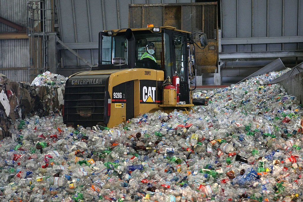 A tractor drives through a giant pile of plastic bottles at the San Francisco Recycling Center April 22, 2008. (Justin Sullivan/Getty Images)