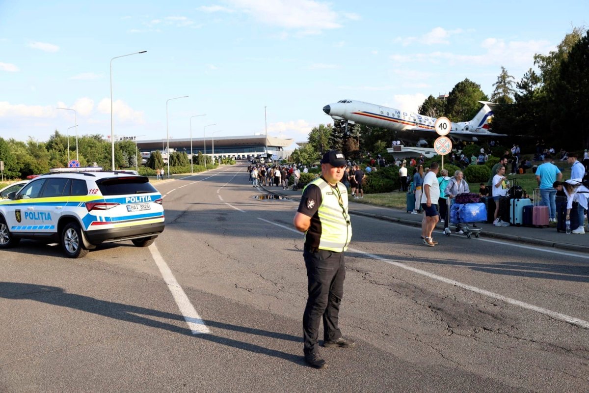 Passengers are evacuated from Chisinau airport in Moldova on June 30, 2023, after a shooting with two victims. (Cristian Straista/AP Photo)