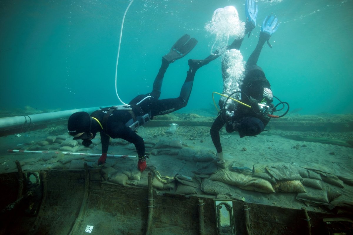 Divers from Valencia University map and assess the state of a 2,500-year-old Phoenician vessel that is submerged 60 meters from the beach of Mazarron in Spain on June 20, 2023. (Jose A Moya/Regional Government of Murcia/Handout via Reuters)