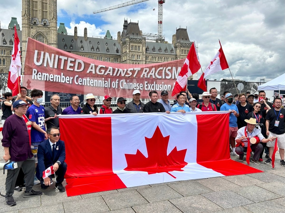 Zhang Jian (8th L) was seen among the key organizers of a protest on Parliament Hill in Ottawa on June 24, 2023. Zhang is a director of the "Commission of Marking the 100th Anniversary of Chinese Exclusion Act" that held the protest. (The Epoch Times)