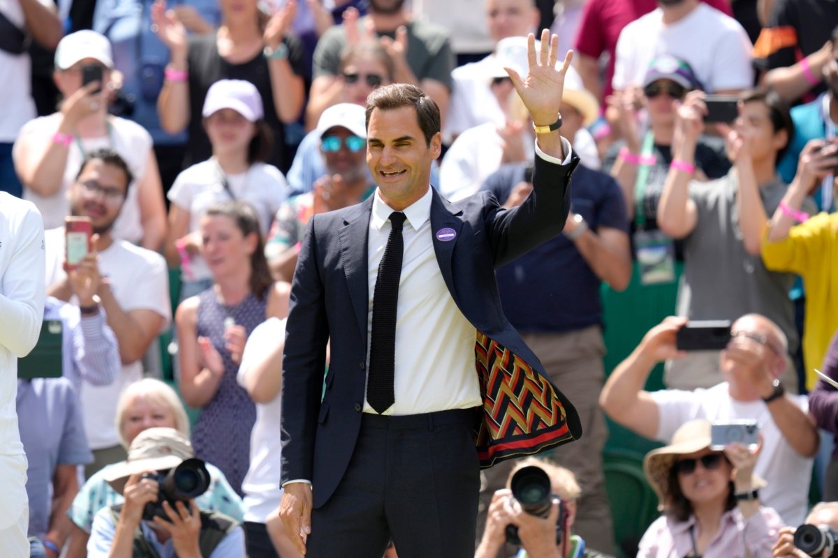 Switzerland's Roger Federer waves during a 100 years of Centre Court celebration on day seven of the Wimbledon tennis championships in London on July 3, 2022. (Kirsty Wigglesworth/AP Photo)