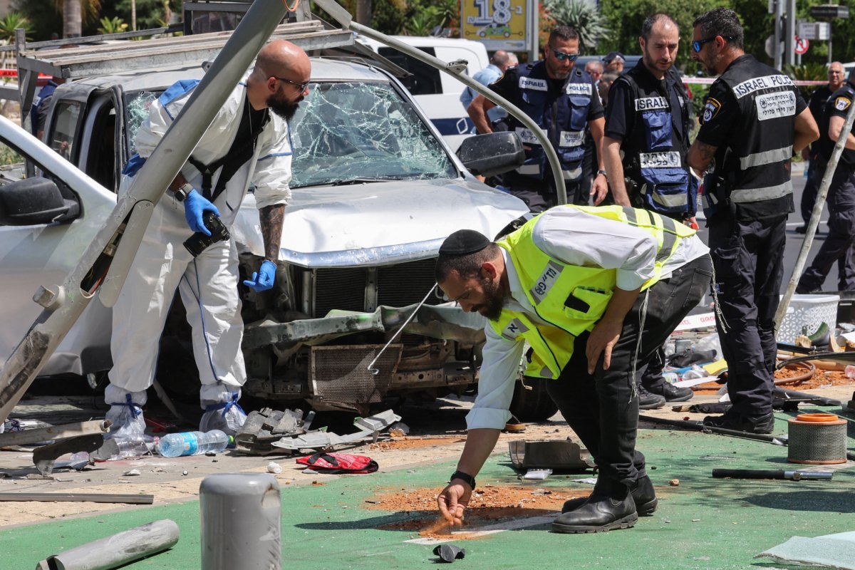 Members of Israeli security and emergency personnel work at the site of a reported car ramming attack in Tel Aviv, Israel, on July 4, 2023. (Jack Guez/AFP via Getty Images)