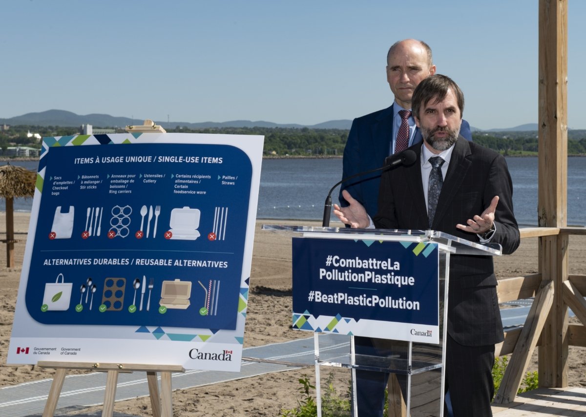Environment Minister Steven Guilbeault, accompanied by Health Minister Jean-Yves Duclos, announces a ban on single-use plastics and items at a beach in Quebec City on June 20, 2022. (The Canadian Press/Jacques Boissinot)