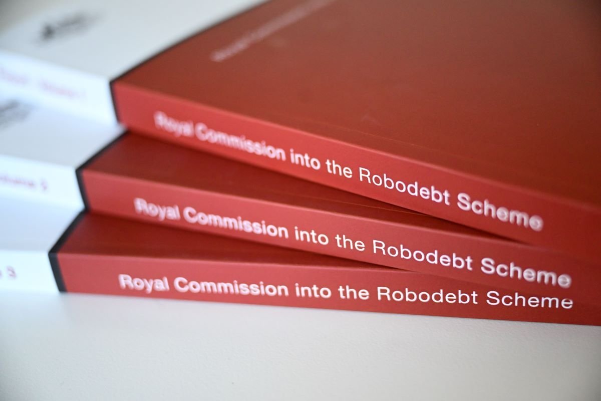 A copy of the Report of the Royal Commission into the Robodebt Scheme is seen at Parliament House in Canberra, Friday, July 7, 2023. (AAP Image/Lukas Coch)