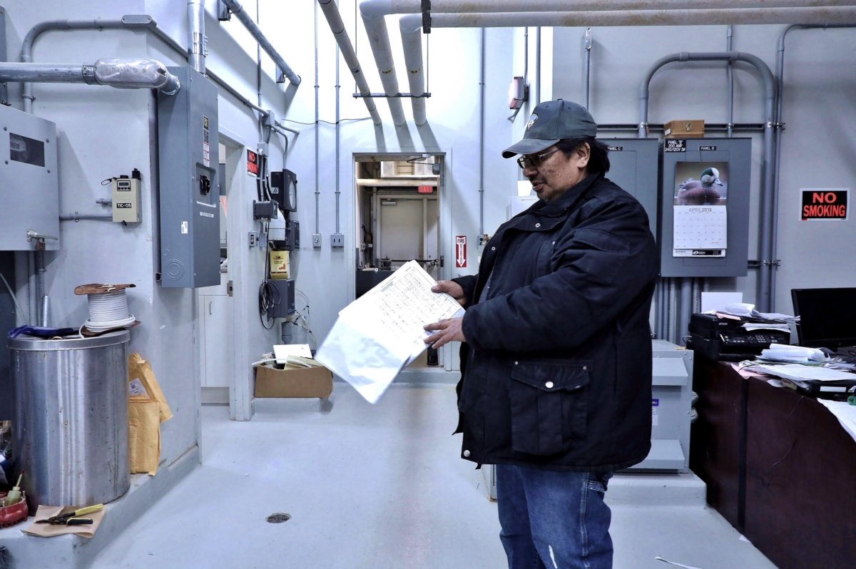 Paul Matthews, a certified water operator, shows off his log sheets in the modern treatment plant in Fort Severn, Ontario's most northerly community, on April 27, 2018. The community is one of a minority of reserves in Canada where tap water is drinkable. (The Canadian Press/Colin Perkel)