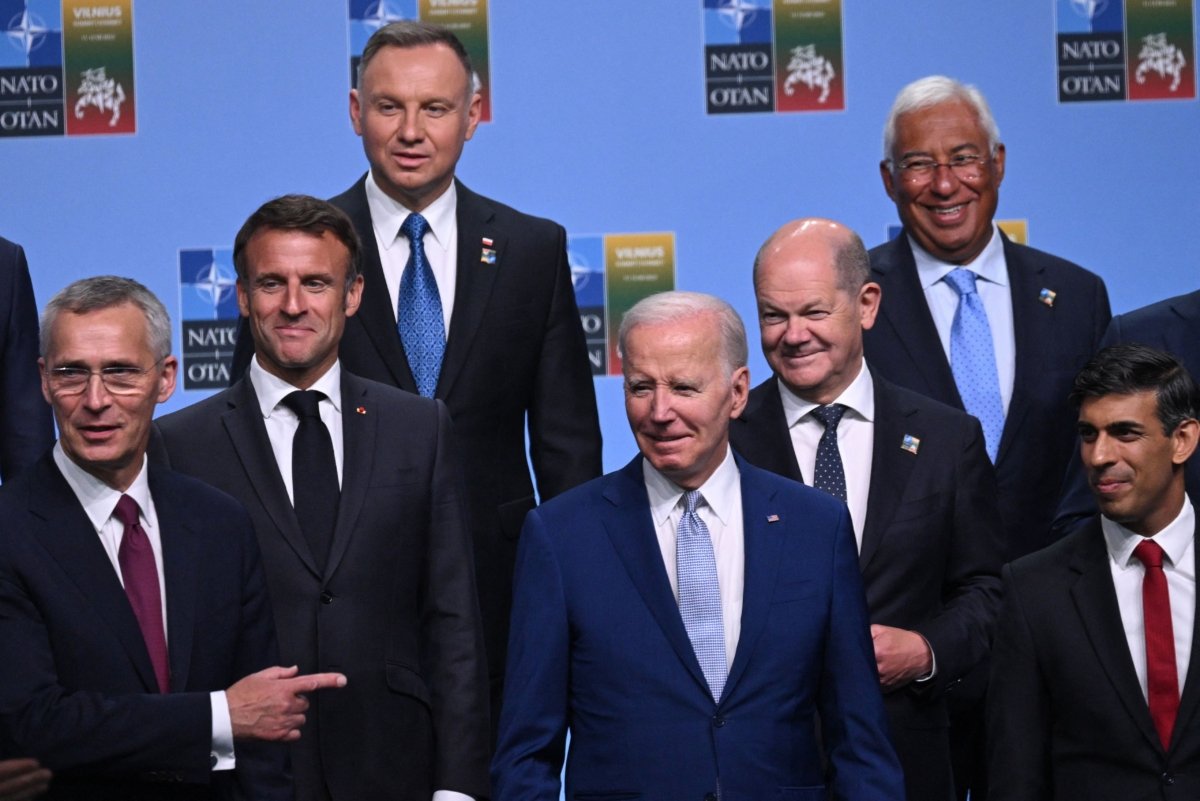 Participants of the NATO Summit including (L-R) NATO Secretary General Jens Stoltenberg, French President Emmanuel Macron, U.S. President Joe Biden, German Chancellor Olaf Scholz, and Britain's Prime Minister Rishi Sunak pose for an official photo in Vilnius, Lithuania, on July 11, 2023. (Andrew Caballero-Reynolds/POOL/AFP via Getty Images)