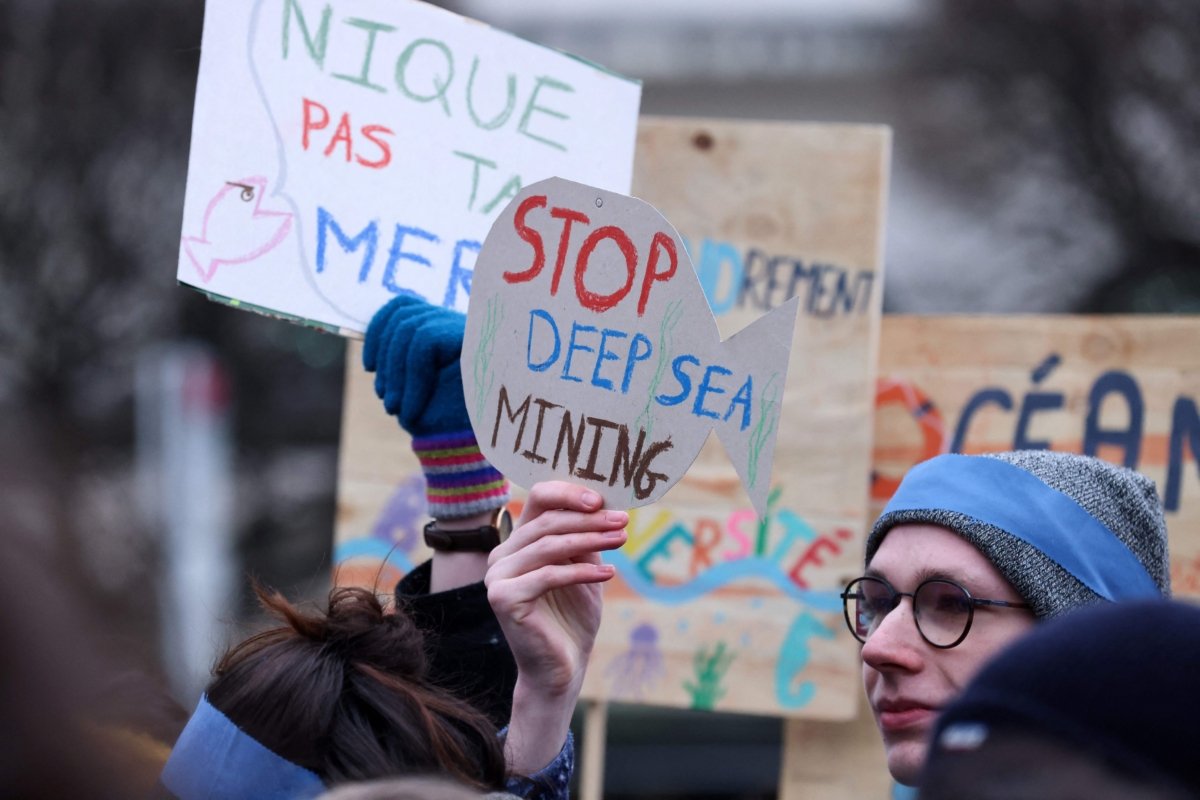 Activists take part at a "Look Down action" rally to stop deep sea mining outside the European Parliament in Brussels on March 6, 2023. (Kenzo Tribouillard/AFP via Getty Images)