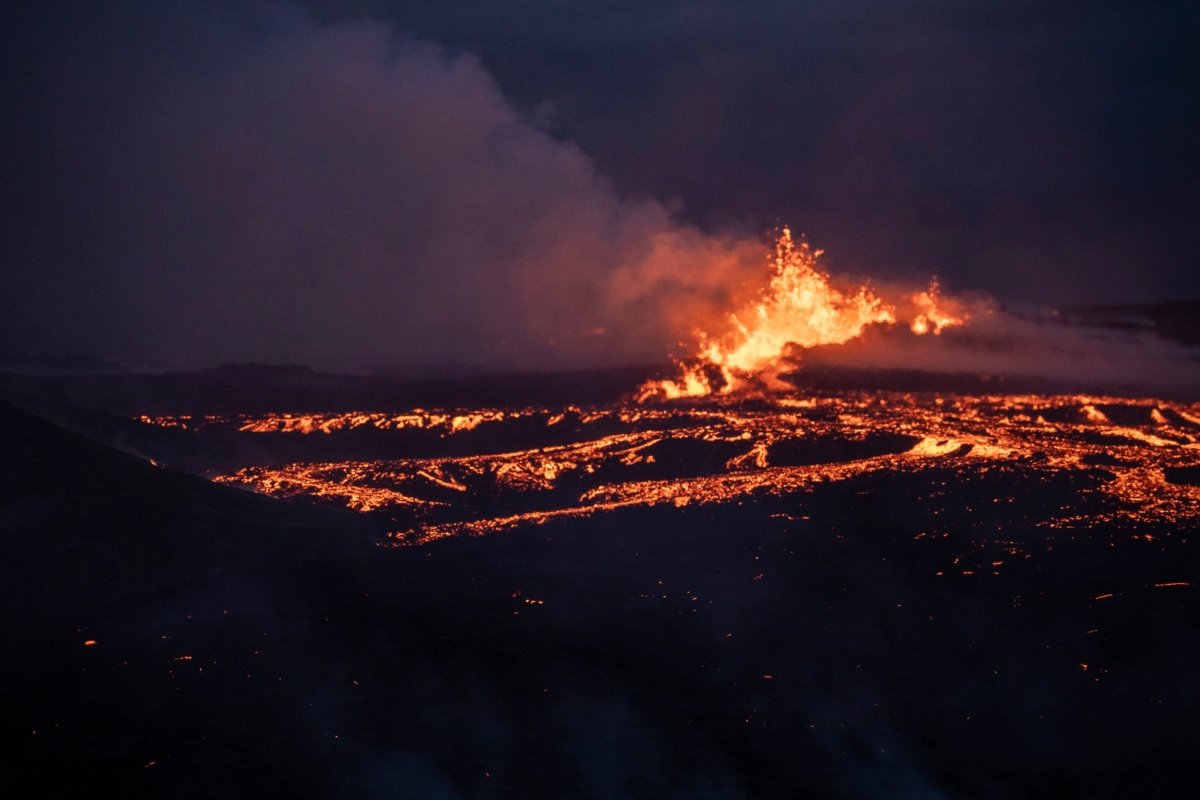Lava emerges from a fissure of the Fagradalsfjall volcano near the Litli-Hrútur mountain, some 30 kilometers (19 miles) southwest of Reykjavik, Iceland, on July 10, 2023. (Marco Di Marco/AP Photo)