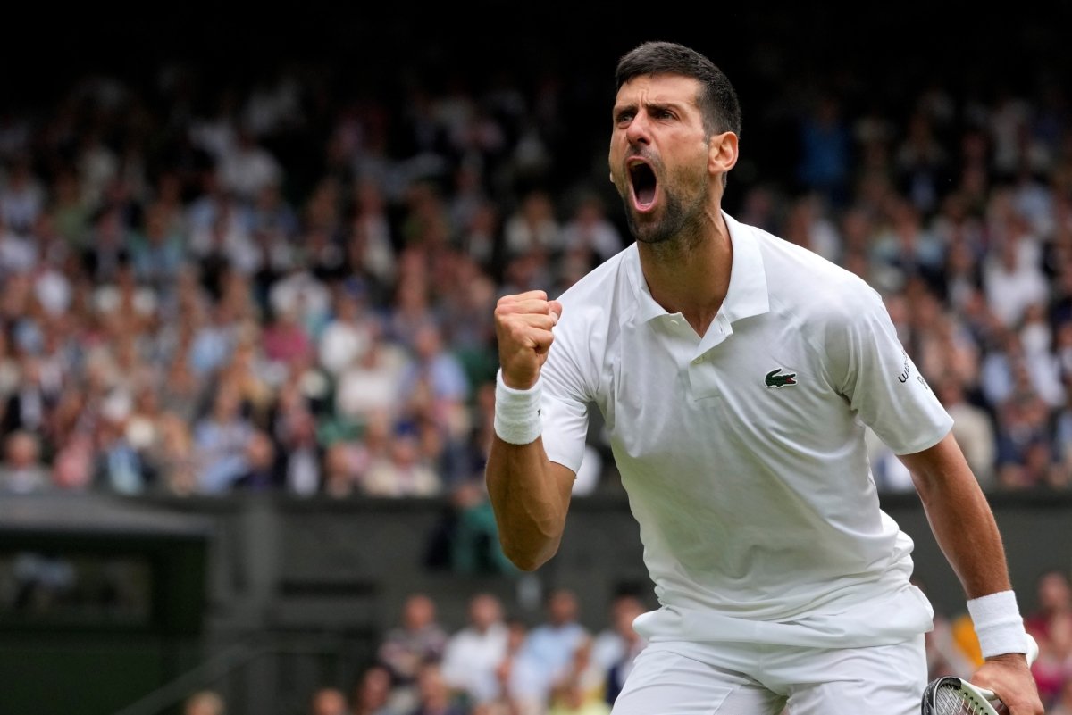 Serbia's Novak Djokovic celebrates winning a point against Russia's Andrey Rublev in a men's singles match on day nine of the Wimbledon tennis championships in London on July 11, 2023. (Kirsty Wigglesworth/AP Photo)