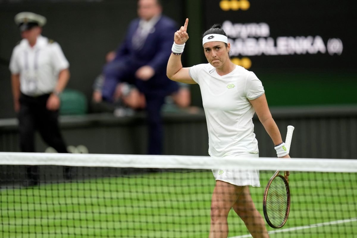 Tunisia's Ons Jabeur celebrates winning a set against Aryna Sabalenka of Belarus during their women's semifinal singles match on day eleven of the Wimbledon tennis championships in London on July 13, 2023. (Kin Cheung/AP Photo)
