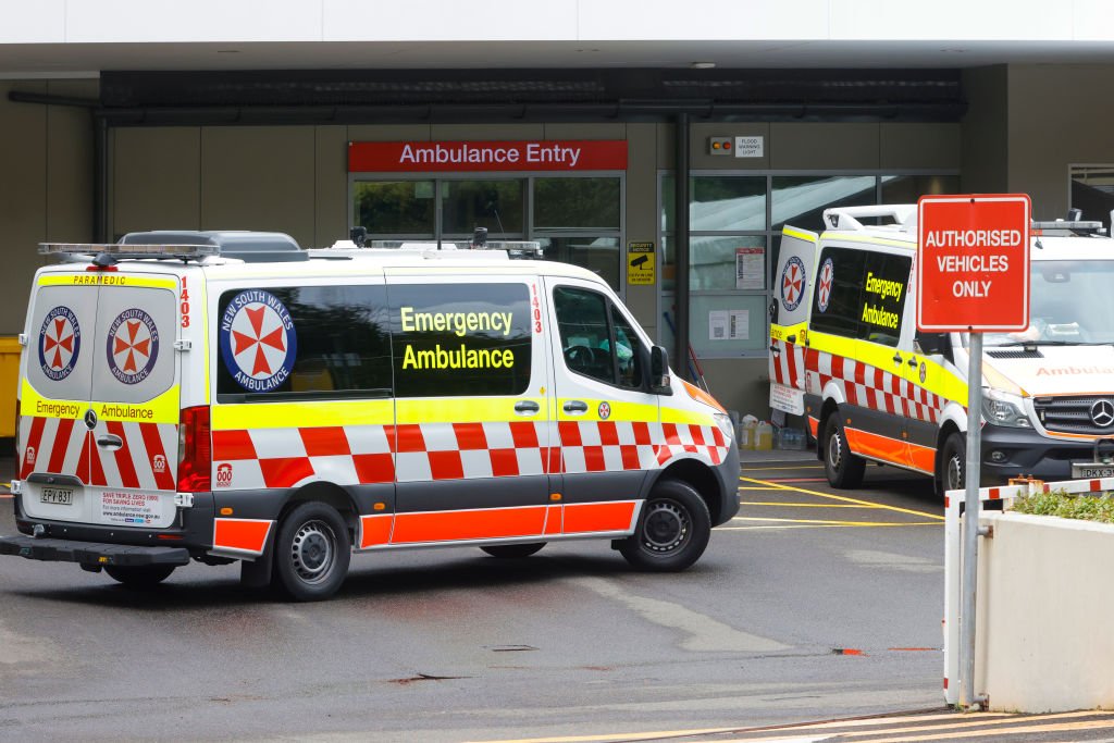 Ambulances arrive at St Vincent's Hospital in Sydney, Australia, on Dec. 28, 2021. (Jenny Evans/Getty Images)