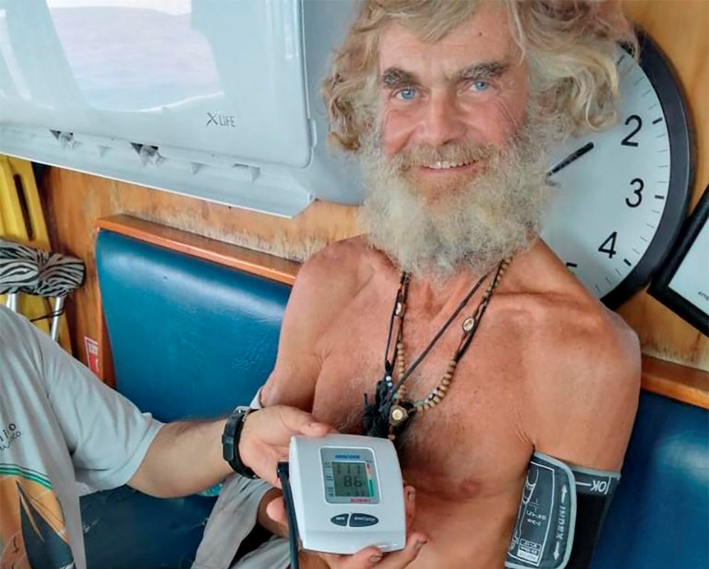 Australian Tim Shaddock has is blood pressure taken after being rescued by a Mexican tuna boat in international waters, after being adrift with his dog for three months on July 12, 2023. (Grupomar/Atun Tuny via AP)