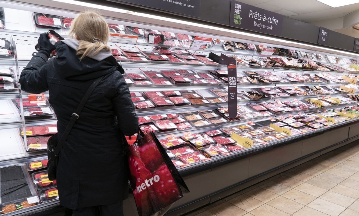 A customer shops at a meat counter in a grocery store in Montreal, on April 30, 2020. (The Canadian Press/Paul Chiasson)