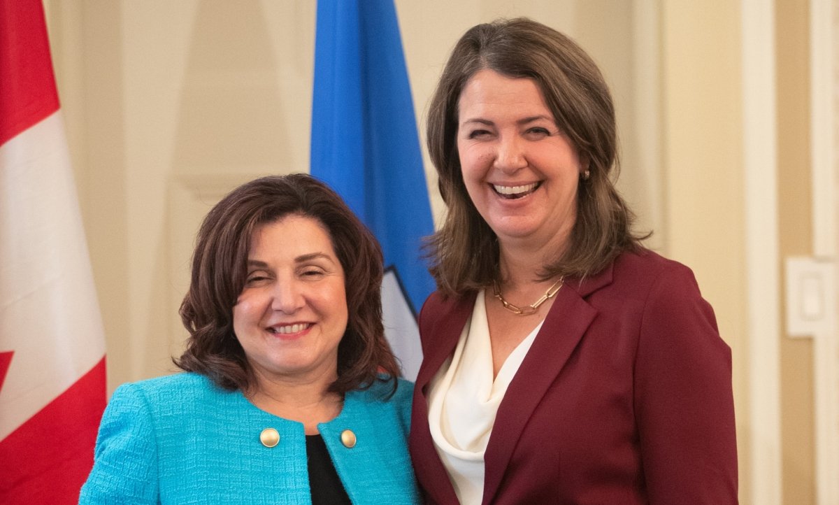 Alberta Premier Danielle Smith and Minister of Health Adriana LaGrange stand together during the swearing in of her cabinet, in Edmonton on June 9, 2023. (Jason Franson/The Canadian Press)