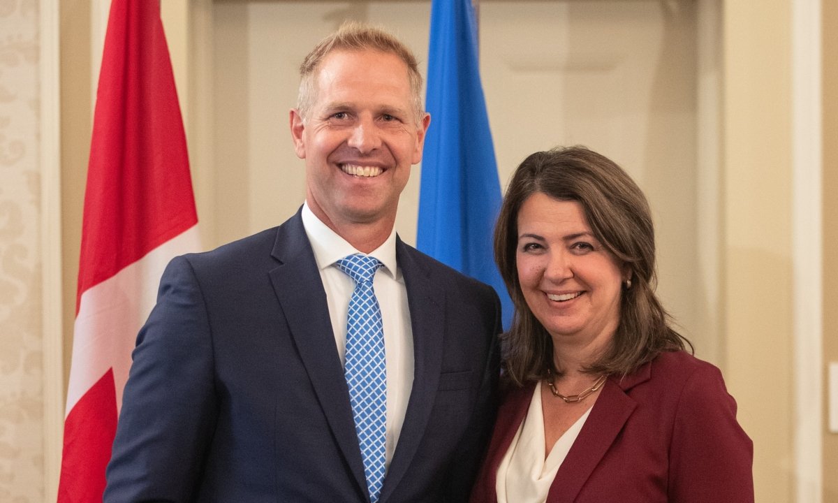 Alberta Premier Danielle Smith and Minister of Affordability and Utilities and Vice-chair of Treasury Board Nathan Neudorf stand together during the swearing in of her cabinet, in Edmonton on June 9, 2023. (Jason Franson/The Canadian Press)
