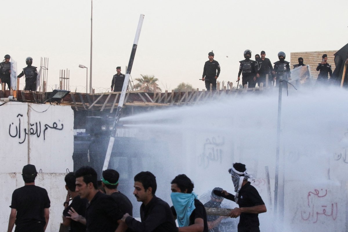 Security forces deploy a water cannon as protesters gather near the Swedish embassy in Baghdad hours after the embassy was stormed and set on fire ahead of an expected Koran burning in Stockholm, in Baghdad on July 20, 2023. (Ahmed Saad/Reuters)