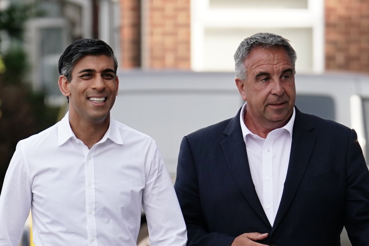 Prime Minister Rishi Sunak and newly elected Conservative MP Steve Tuckwell arriving at the Rumbling Tum cafe in Uxbridge, west London, on July 21, 2023. (Jordan Pettitt/PA Media)