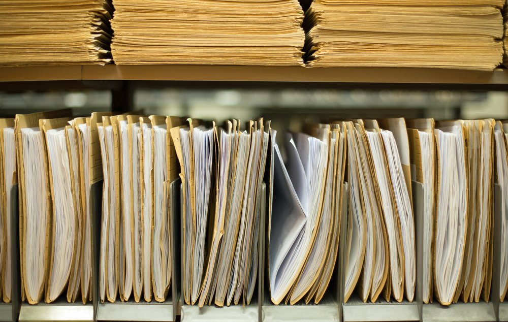 File folders containing documents are are stacked on shelves in a file photo. (Harry Huber/Shutterstock)